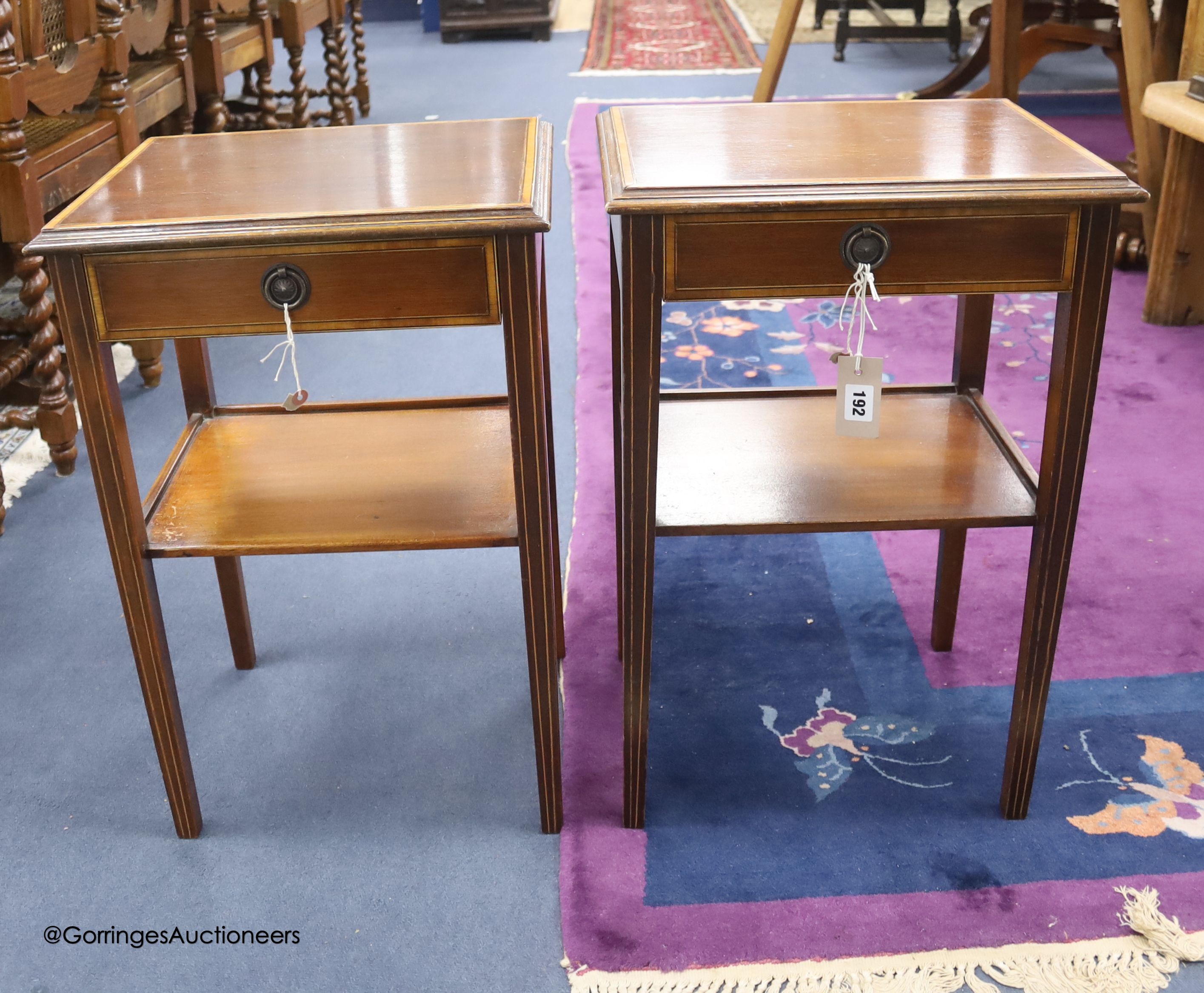 A pair of satinwood banded mahogany two tier tables, from Officer's Mess RAF Biggin Hill, sold by the Ministry of Defence, Feb 1994, width 41cm depth 33cm height 61cm